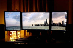 this 3 monitor stand shows off the nyc skyline beautifully